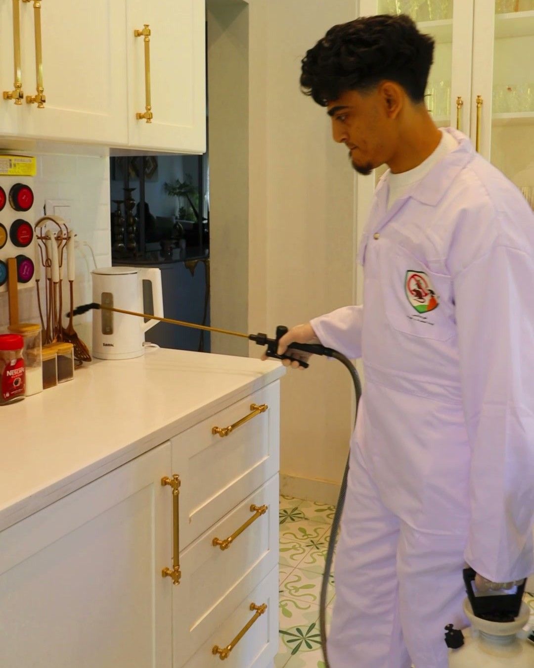 A Formax technician in uniform inspecting a kitchen in an Egyptian home